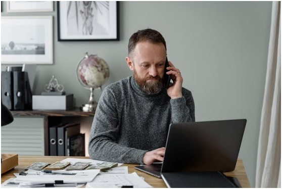 property manager sitting at their desk taking a phone call